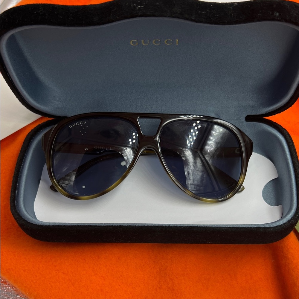 Gucci Authenticity Certificate with Orange and Green Accents